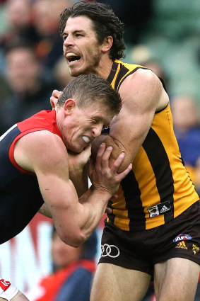 Hawthorn's Isaac Smith and Sam Frost tangle.