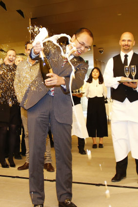 Managing director Sherwood Luo celebrates the completion of the Lucent apartment complex in North Sydney in 2016.