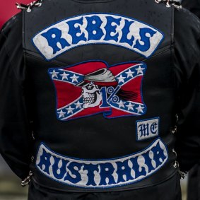 One of the men arrested is a member of the Rebels outlaw motorcycle gang.
