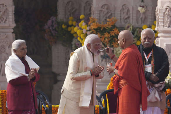 Indian Prime Minister Narendra Modi, centre, breaks his ritualistic fast after opening the temple dedicated to Hinduism’s Lord Ram in Ayodhya, India.