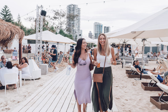 Patrons enjoy a drink at the Kurrawa Beach Club over summer.