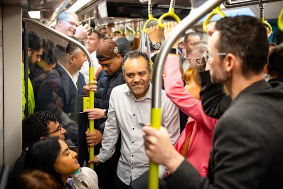 People packed into the train for the first service from Bankstown station.