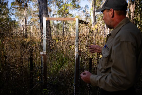 Yourka Reserve Manager Brian Wienert explains a feral pig trap.
