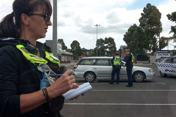 Victoria Police issue pandemic-related fines at a refugee rights protest in Preston earlier this year.