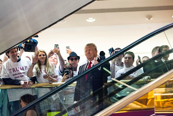 Never knowingly understated: Donald Trump announces his run for president in June 2015 by descending a golden escalator at Trump Tower in New York.