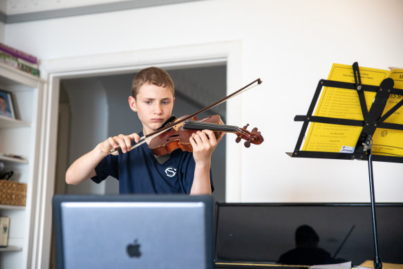 A student from Cranbrook completes a remote music lesson.