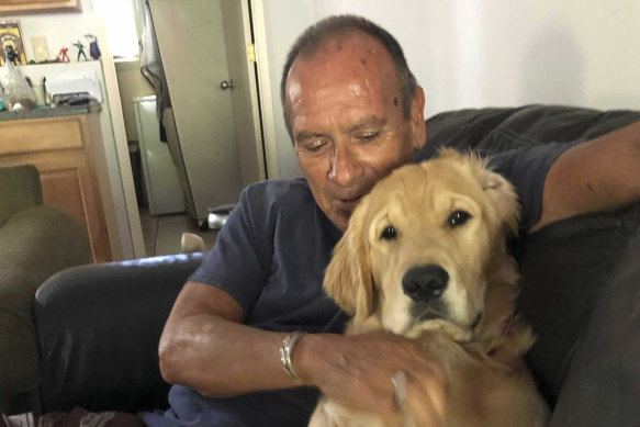 Franklin Trejos with his golden retriever Sam. Trejos died in the Lahaina wildfires while using his body to shield Sam in the back of his car.