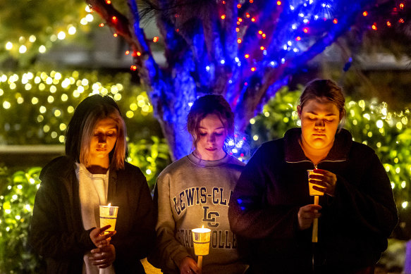 Students and others pay their respects at a vigil for the four University of Idaho students killed in Moscow, Idaho.