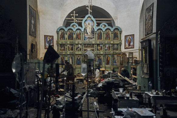 Ukrainian soldiers inspect a church used as a Russian military hospital in Izyum.