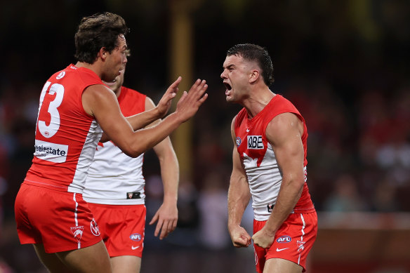 Tom Papley celebrates kicking a goal with Swans teammate Oliver Florent.