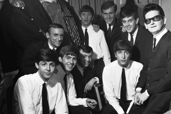 The Beatles pose with Roy Orbison and Gerry and the Pacemakers backstage in their dressing room during a 1963 British tour. From left: Paul McCartney, Freddie Marsden (behind), George Harrison, Gerry Marsden, Ringo Starr (back), Les Maguire (back), John Lennon, John 'Les' Chadwick (back), Roy Orbison. 