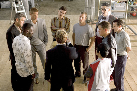 Geroge Clooney (clockwise from far left), Brad Pitt, Casey Affleck, Scott Caan, Elliott Gould, Eddie Jemison, Matt Damon, Shaobo Qin and Don Cheadle in a scene from Ocean’s Twelve. 