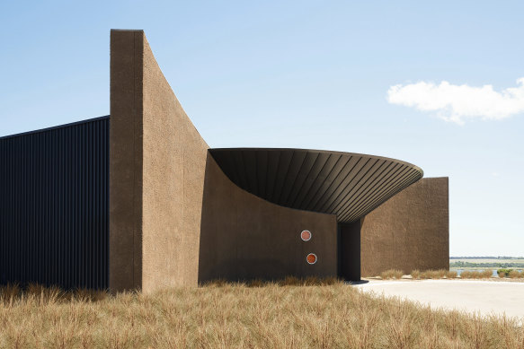 The rendered masonry walls are in mocha and coffee hues that evoke the silted residue over a stingray.