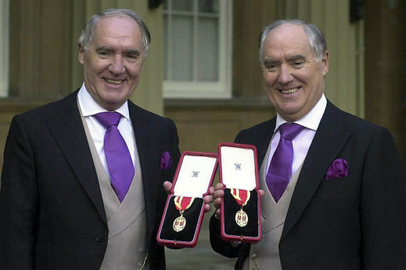 Frederick Barclay, right, with his twin brother, David, after receiving knighthoods from the Queen at Buckingham Palace in 2000.