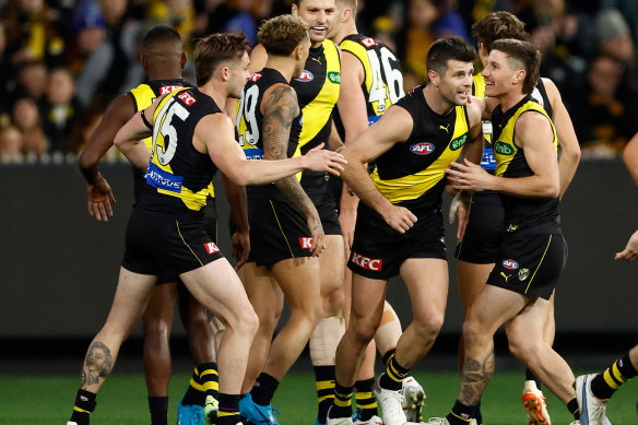 Trent Cotchin and the Tigers celebrate a goal.