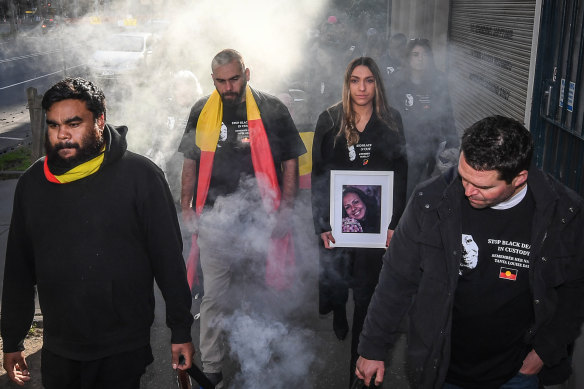 Tanya Day's family and supporters take part in a smoking ceremony ahead of the 2019 inquest into her death.