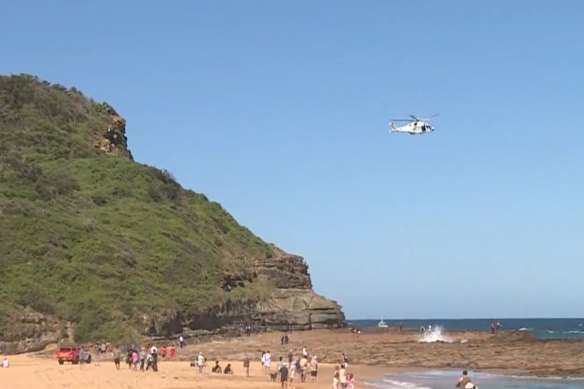 A search is under way for a 15-year-old boy swept off a rock shelf at North Avoca Beach on Tuesday.
