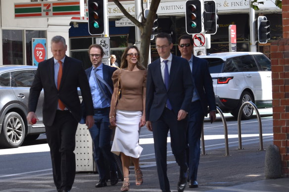 Bianca Rinehart and John Hancock arriving flanked by lawyers on Tuesday, the second day of closing submissions in the Hope Downs civil trial.