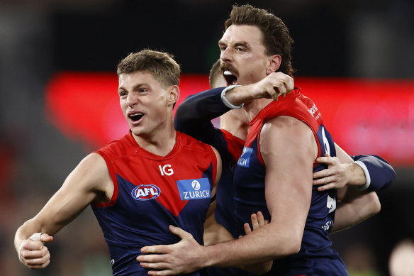 Demons players celebrate on the final siren.