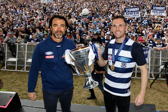 Coach Chris Scott and Joel Selwood greet fans at Geelong with the 2022 flag. 