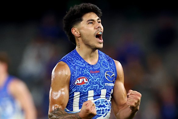 North Melbourne’s Paul Curtis celebrates a key moment.