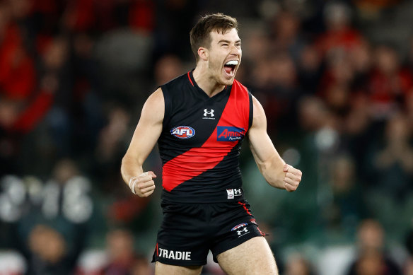 Essendon captain Zach Merrett celebrates a goal in the win over the Crows.