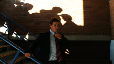 A reluctant farewell . . . pursued to the end by a media pack, Andrew Johns leaves his news conference at the Knights stadium on April 10, 2007.