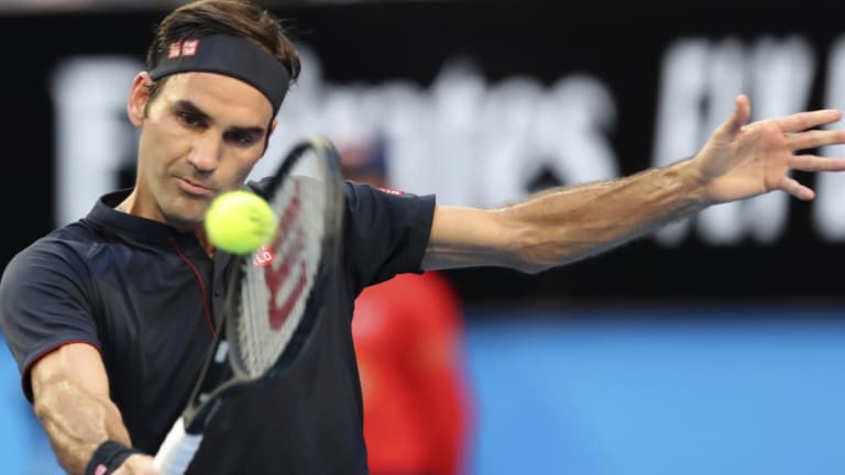 Imperious: Roger Federer plays a backhand against Alexander Zverev of Germany as the Swiss combined power and touch to win the opening rubber.
