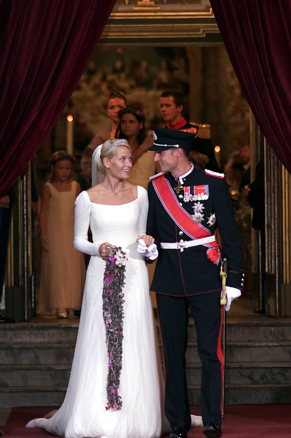 Newlyweds Prince Haakon and Princess Mette-Marit leave Oslo Cathedral in 2001.     