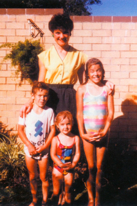 Pauline Hanson in the front yard of the family home in Ipswich with three of her children: Adam, Lee and Amanda.
