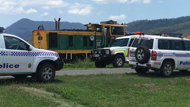 Emergency crews at the scene of the fatal cane train incident near Mackay.