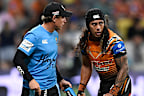 Tigers trainer Brett Hodgson attends to Jarome Luai. 