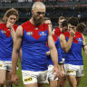 A dejected Melbourne leave the MCG after their third loss in a row.
