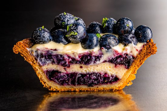 Blueberry tart, with baked cheesecake, blueberry jam, vanilla cream and blueberries.