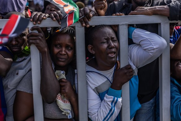 People react during the viewing of the body of former Kenyan Prime Minister Raila Odinga at Jomo Kenyatta Stadium in Kisumu, Kenya.