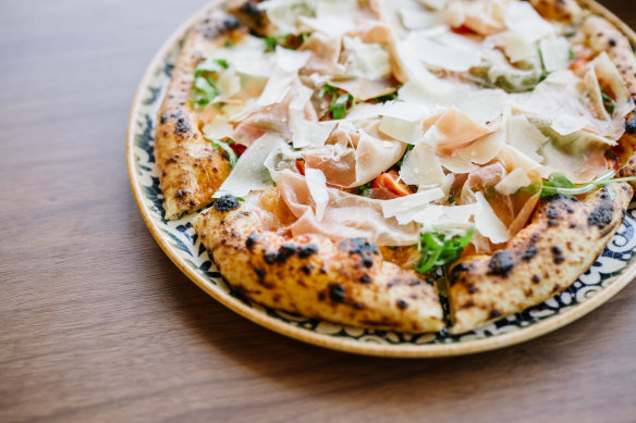 San Daniele prosciutto pizza with cherry tomato, rocket, shaved parmesan.