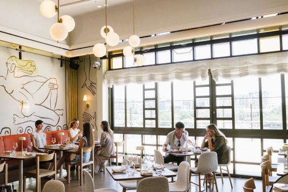 Design studio Tom Mark Henry has lent Cucina Regina elegant timber and tiled floors, fetching coloured-pane windows and beautiful wall art.