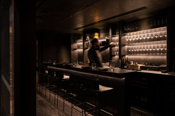 Inside Reine’s dark and moody adjoining bar, La Rue.