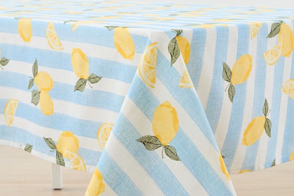 Soft stripes and citrus motifs create an instant, sun-drenched backdrop for a long afternoon outdoors.