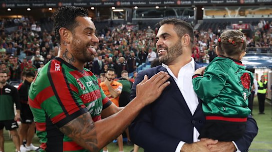 Old boys' club: John Sutton and Greg inglis share a joke after the defeat of the Broncos, however, Sutton's rendition of the 'goanna' didn't go down quite as well as when Inglis performed the try celebration.