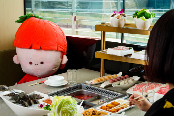 Dine with a plushie pal at Haidilao.