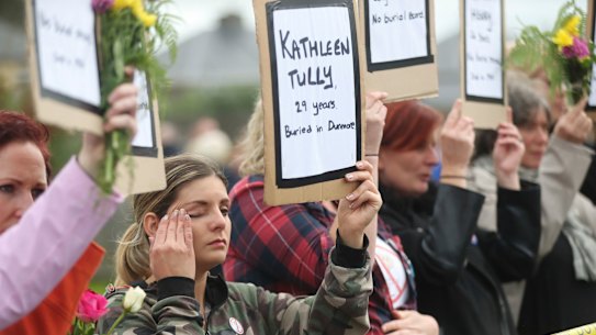 Protesters hold up the names of children at the site of the former Tuam home for unmarried mothers in County Galway, 2018.