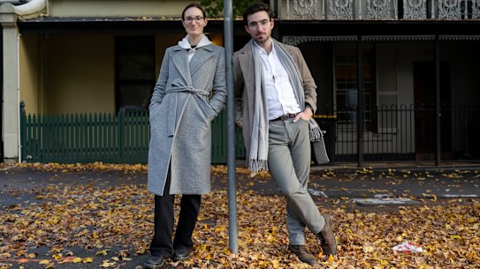Katie Roberts-Hull and Jonathan O’Brien from the YIMBY group ( Yes In My Back Yard)  in fromt of some single fronted terrace homes in Grattan Street Carlton. Under the YIMBY’s ‘Missing Middle’ proposal, streets like this would be rezoned to accomodate six-storey buidings.

