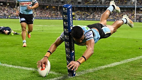 Ronaldo Mulitalo scores a spectacular try in the corner for the Sharks.