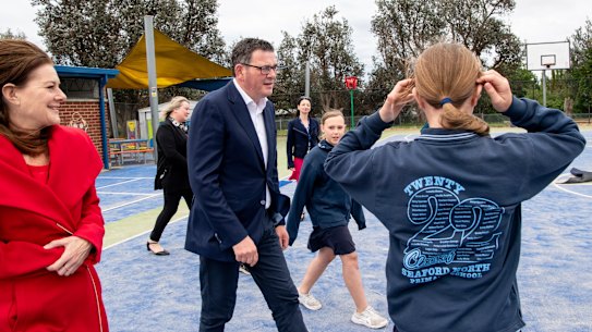 Then-premier Daniel Andrews announces a schools package on the campaign trail during the 2022 election campaign, with Planning Minister Sonya Kilkenny (left).