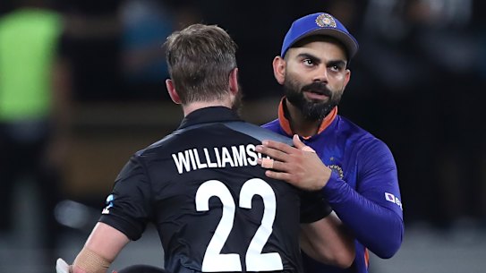 A dejected Virat Kohli congratulates New Zealand counterpart Kane Williamson after tournament favourites India slumped to a second straight T20 World Cup defeat.