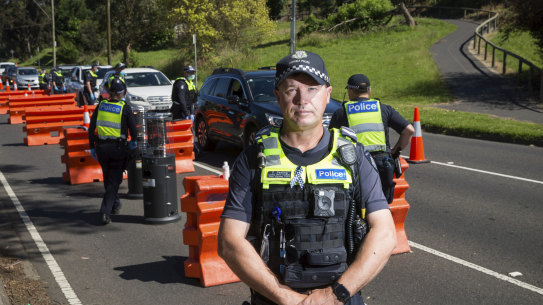 Leading Senior Constable Paul Gosling at the Upper Ferntree Gully Vehicle checkpoint on Sunday, its last day of operation. 