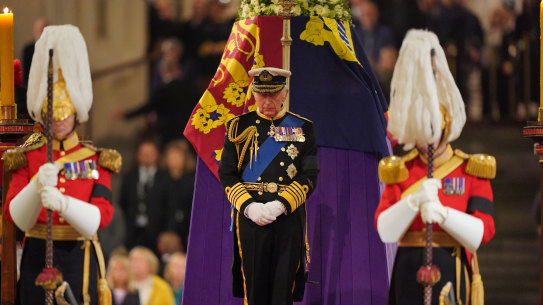 King Charles III stands vigil beside the coffin of his mother, Queen Elizabeth II, in Westminster Hall.