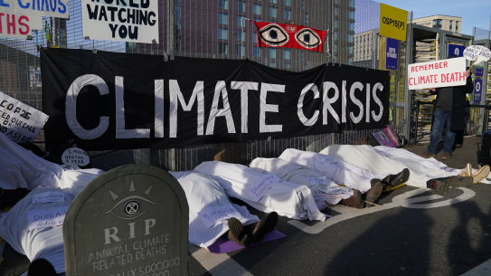 Climate activists stage a protest near the venue for the COP26 UN Climate Summit in Glasgow.
