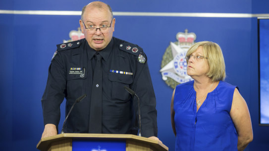 Chief Commissioner Graham Ashton with Police Minister Lisa Neville at a media conference in February.